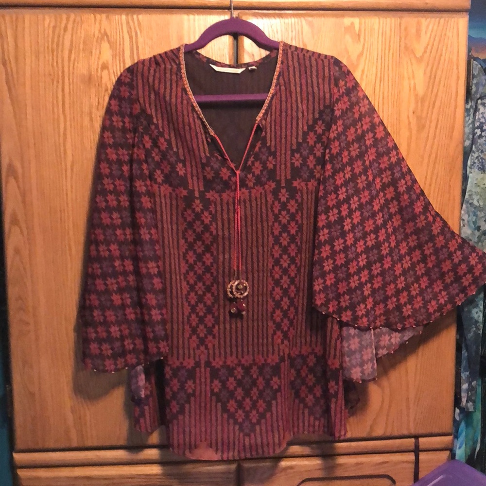 Poncho-like flowing rust and brown blouse
